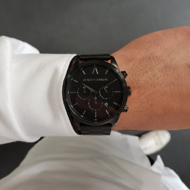 Black Stainless Steel Chronograph Watch with a black Full Grain Leather Strap for men by GenerationNow, Model The Dark Knight, worn by model