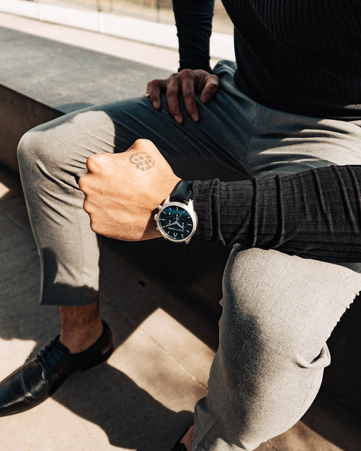 Silver and black Stainless Steel Chronograph Watch with a black Full Grain Leather Strap for men by GenerationNow, Model Prometheus, worn by model