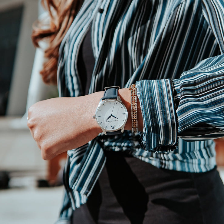 Blue, white and silver Stainless Steel Classic Watch with a blue Full Grain Leather Strap for women by GenerationNow, Model Calypso, worn by model