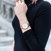 Rose pink and white Stainless Steel Chronograph Watch with a pink Full Grain Leather Strap for women by GenerationNow, Model Aphrodite, worn by model